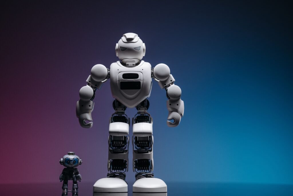 Large and small humanoid robots standing side by side, representing the performance comparison between Claude Sonnet 5 and Claude Opus 4.8